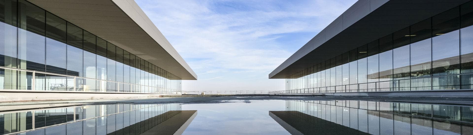 'White Building Reflecting on Water' by Pixabay, Pexels